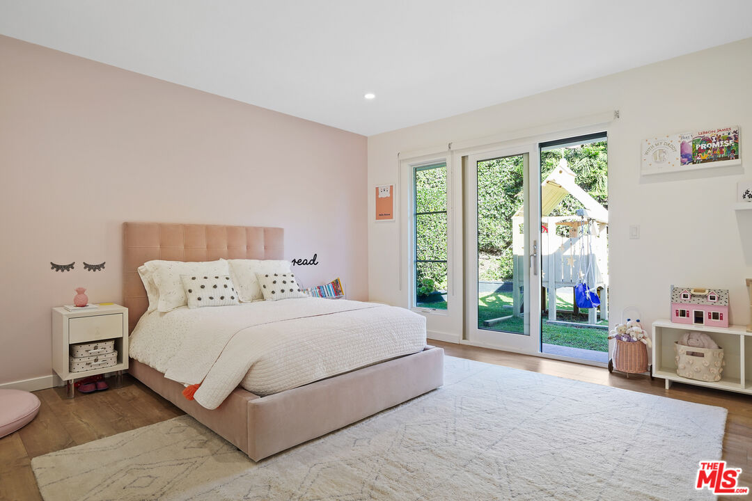 20413 Roca Chica Drive Malibu, CA 90265 - Photo 21 of 27 a bedroom with a bed and a dresser