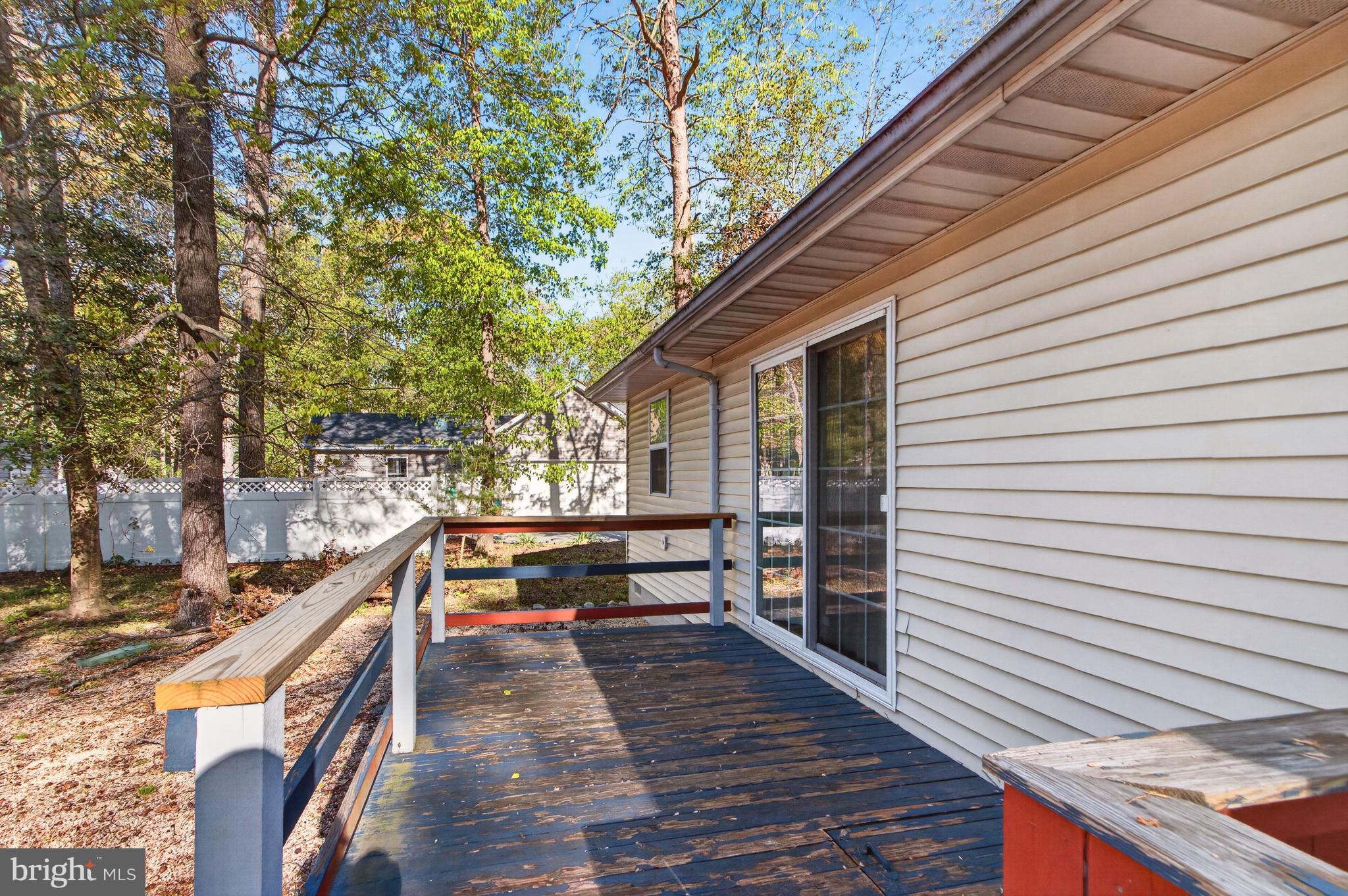 116 Red Cedar Drive Milton, DE 19968 - Photo 31 of 44 a balcony with chairs and with wooden fence