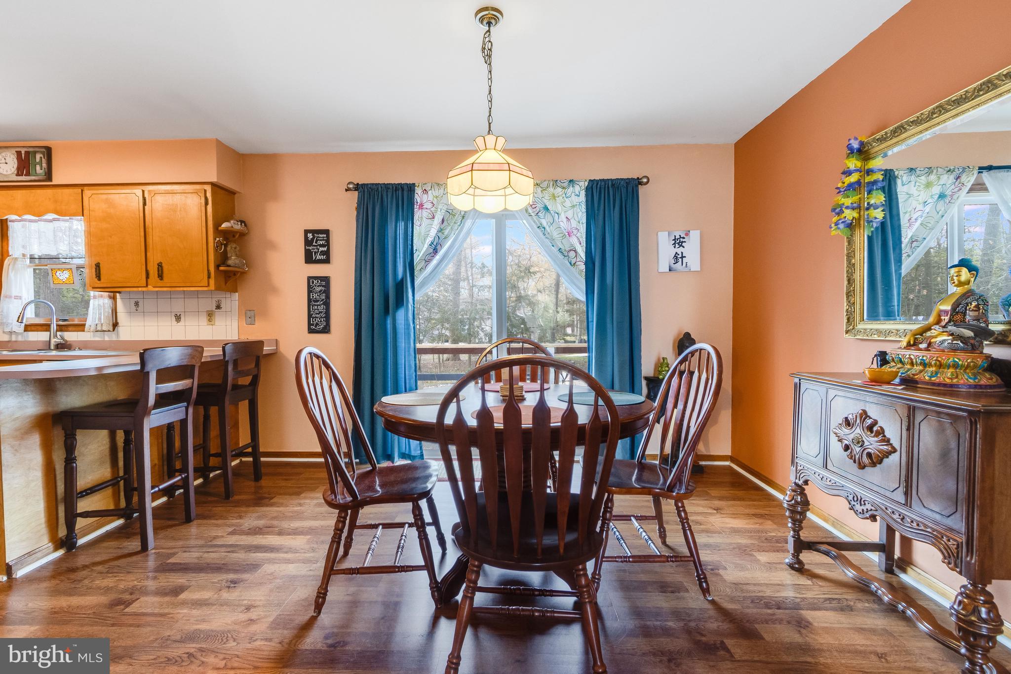 116 Red Cedar Drive Milton, DE 19968 - Photo 8 of 44 a view of a dining room with furniture window and wooden floor