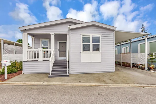 a view of a white house with a large windows