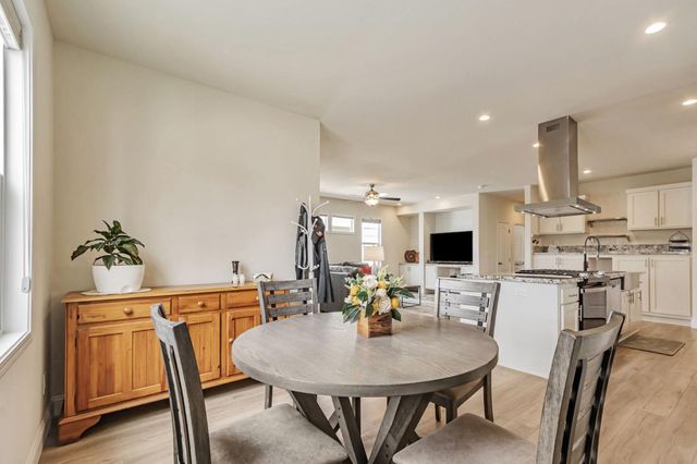 a view of kitchen with dining table and chairs