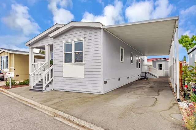 a view of a house with a yard and garage