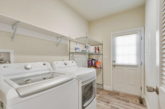 a view of a hallway with washer and dryer