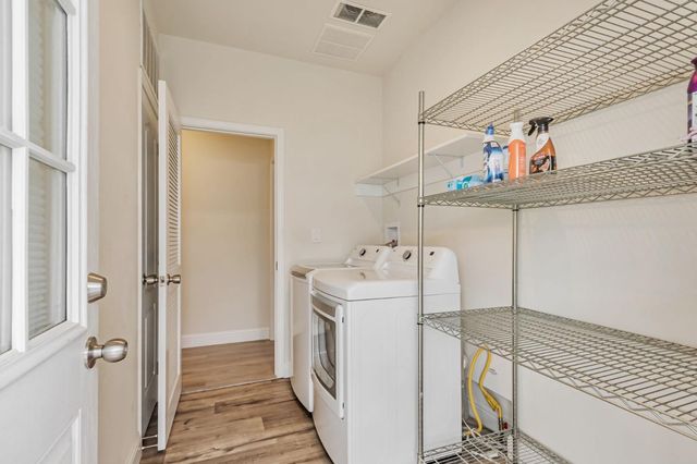 a view of staircase with white walls and windows
