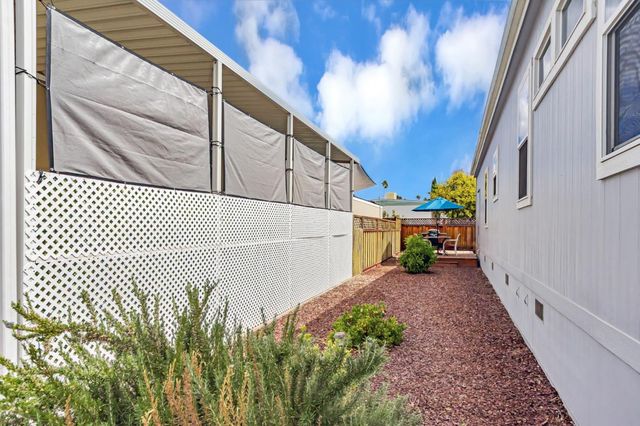 an outdoor space with furniture and umbrella