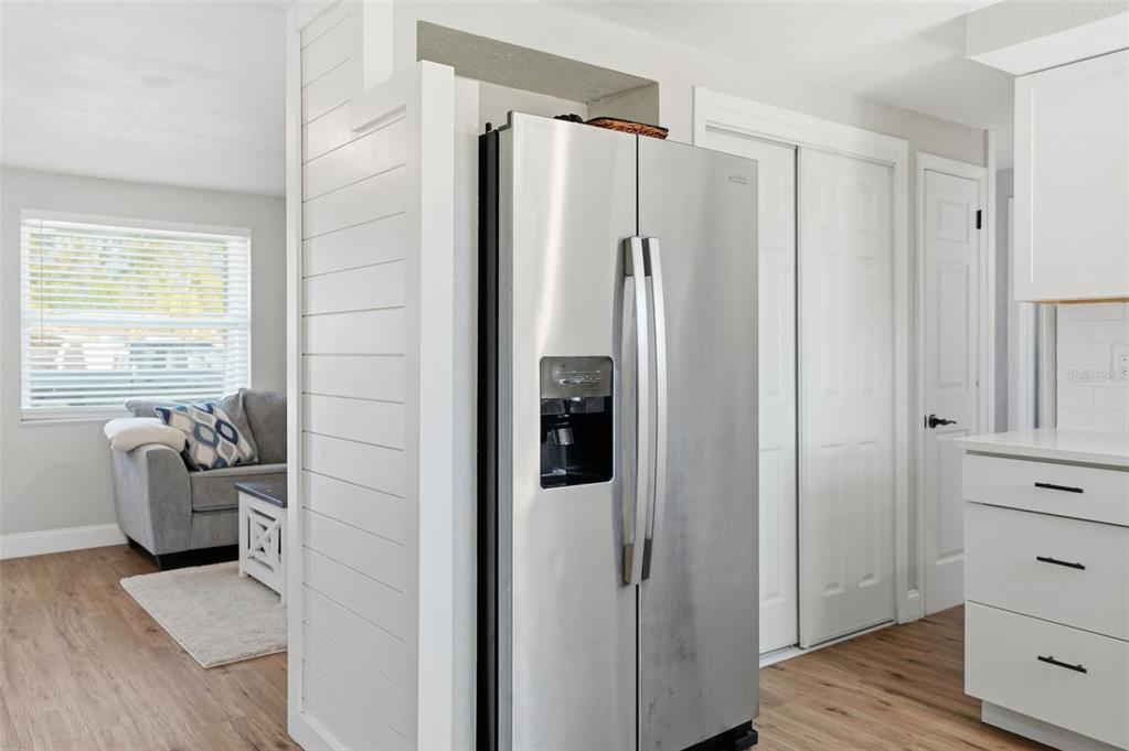 4750 Foothill Drive Holiday, FL 34690 - Photo 17 of 38 a walk in closet with wooden floor and windows