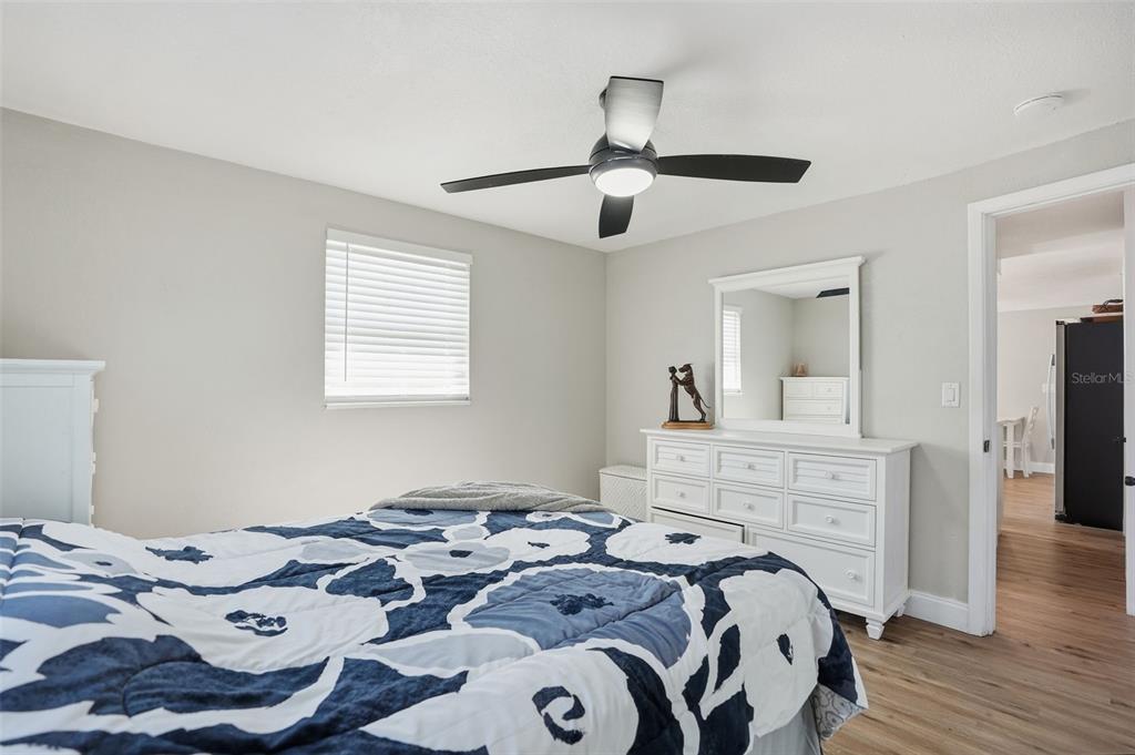 4750 Foothill Drive Holiday, FL 34690 - Photo 20 of 38 a bedroom with a bed and wooden floor