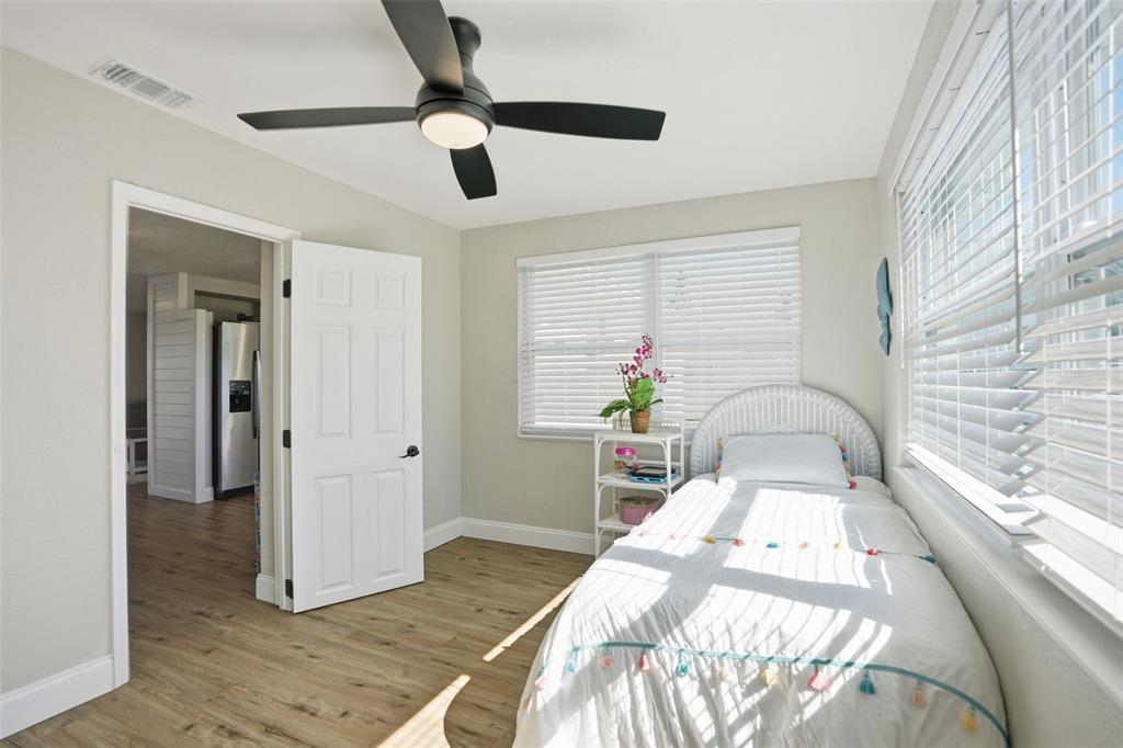 4750 Foothill Drive Holiday, FL 34690 - Photo 27 of 38 a bedroom with a bed and a window