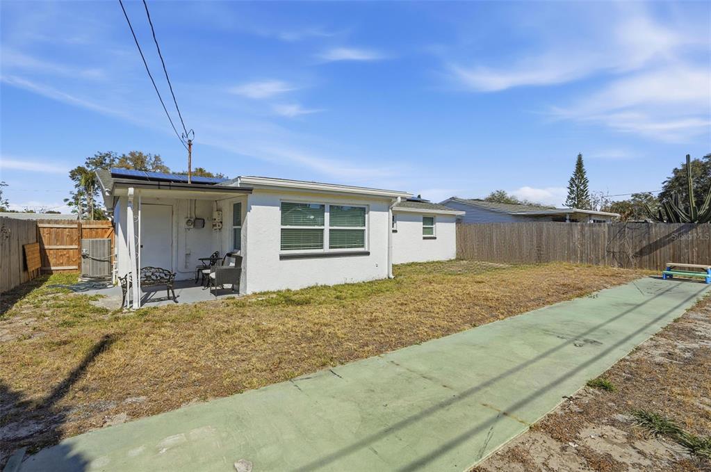 4750 Foothill Drive Holiday, FL 34690 - Photo 30 of 38 a view of a house with backyard and chair