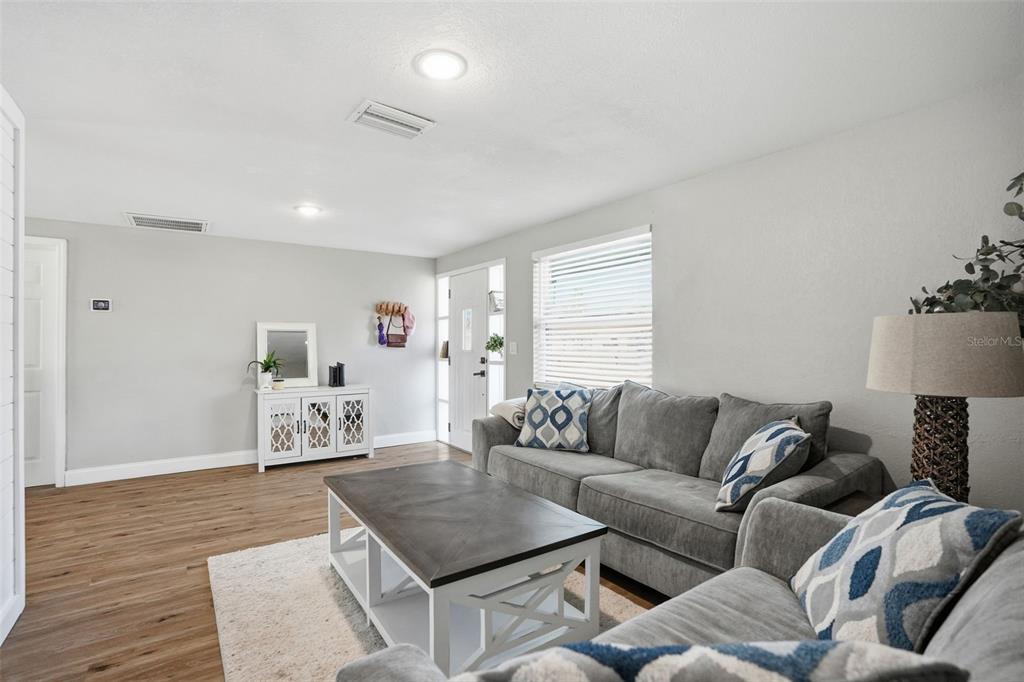 4750 Foothill Drive Holiday, FL 34690 - Photo 9 of 38 a living room with furniture and a wooden floor