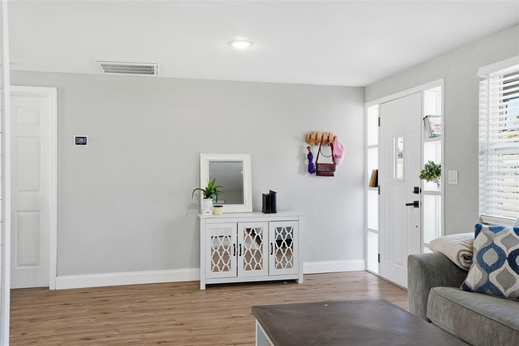 4750 Foothill Drive Holiday, FL 34690 - Photo 10 of 38 a living room with furniture and wooden floor