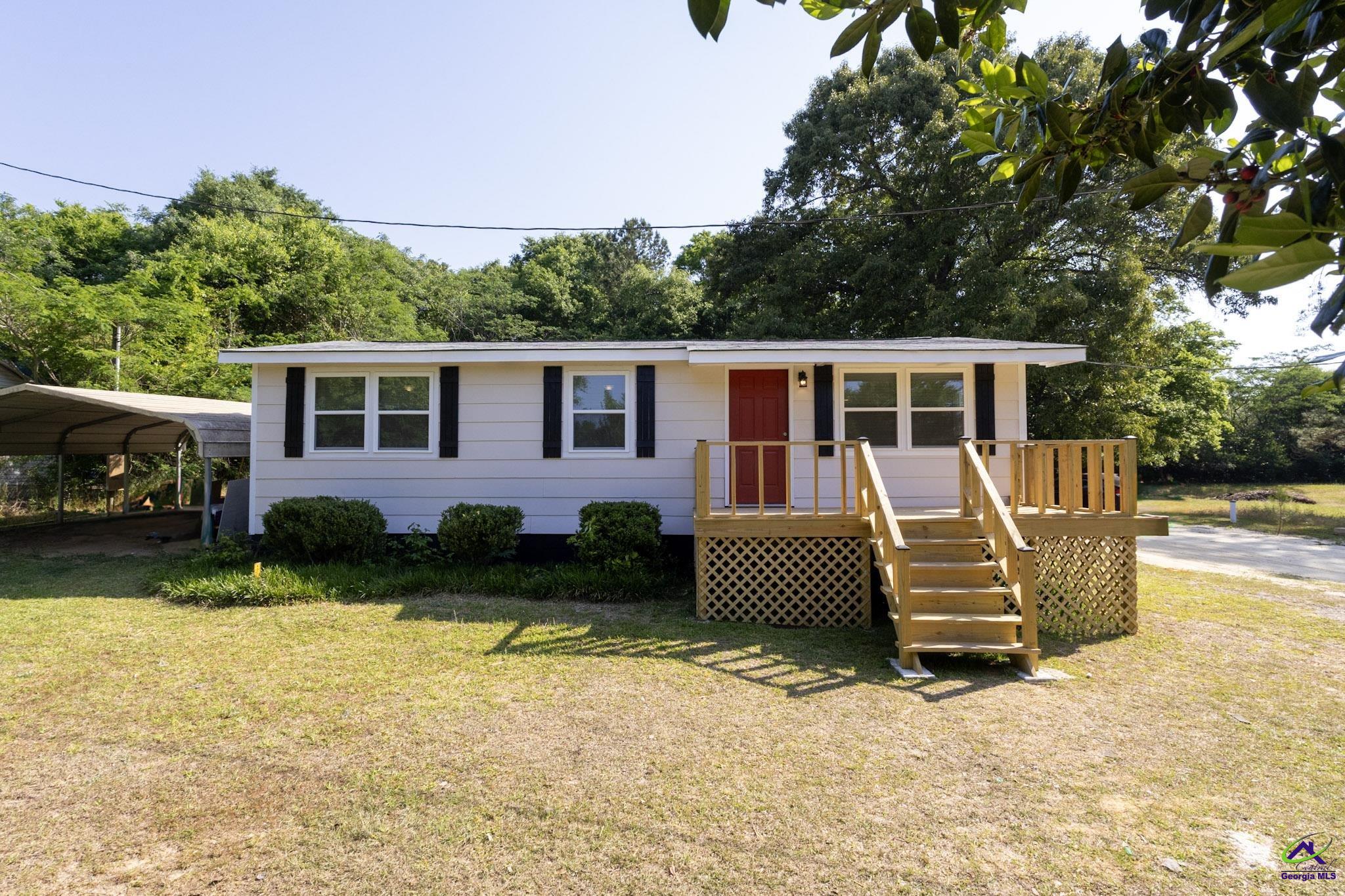 156 Churchwell Road Cochran, GA 31014 - Photo 1 of 20 a view of a house with a yard and sitting area