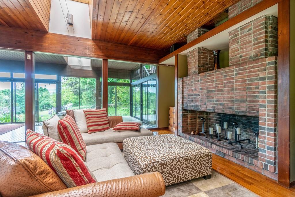 67 Conant Road Lincoln, MA 01773 - Photo 12 of 38 a outdoor living space with patio furniture and a fireplace