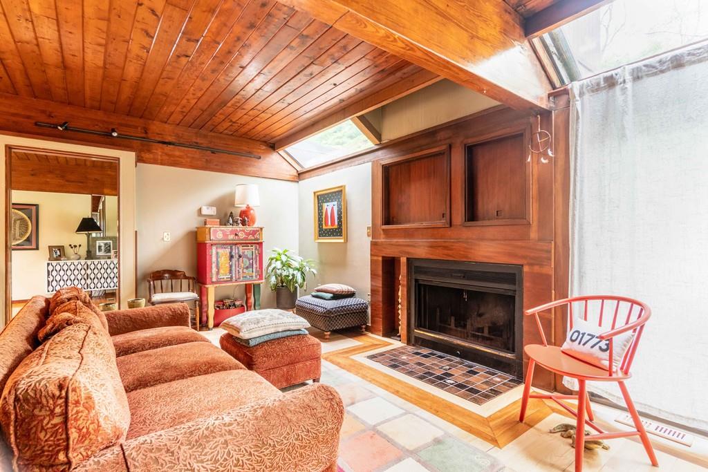 67 Conant Road Lincoln, MA 01773 - Photo 23 of 38 a outdoor living space with furniture a fireplace and a window