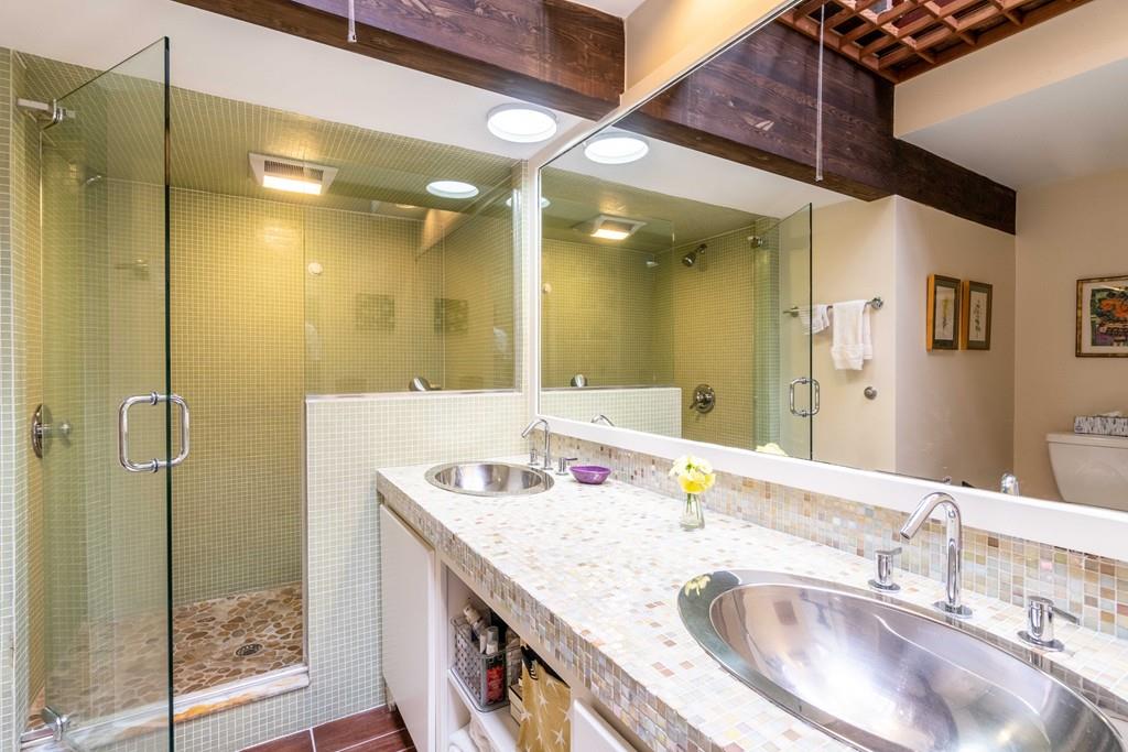 67 Conant Road Lincoln, MA 01773 - Photo 36 of 38 a bathroom with a granite countertop sink a mirror and shower