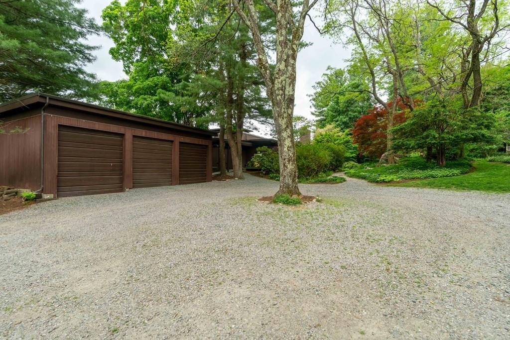 67 Conant Road Lincoln, MA 01773 - Photo 37 of 38 a house with trees in front of it