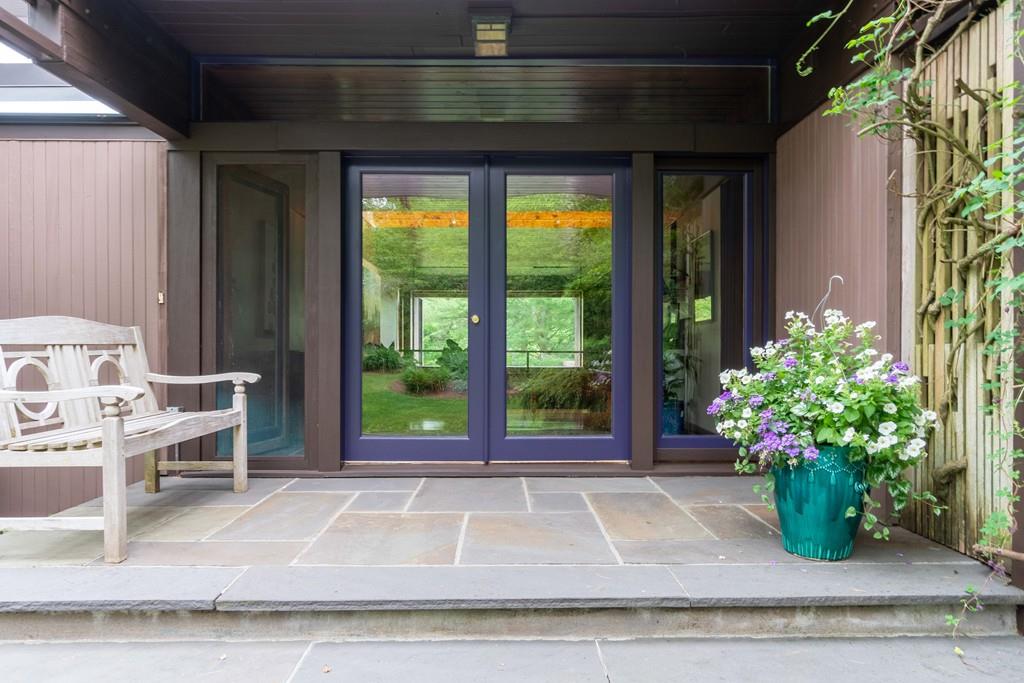 67 Conant Road Lincoln, MA 01773 - Photo 5 of 38 a view of a house with a porch