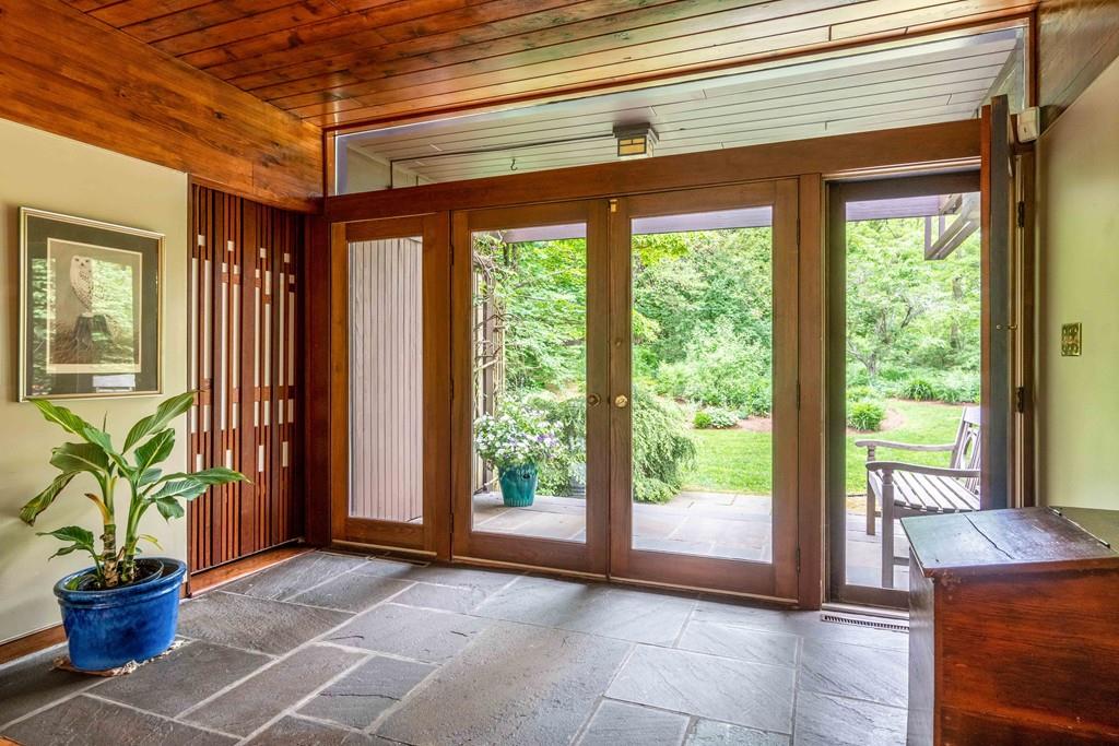 67 Conant Road Lincoln, MA 01773 - Photo 6 of 38 a view of front door and porch with a chair