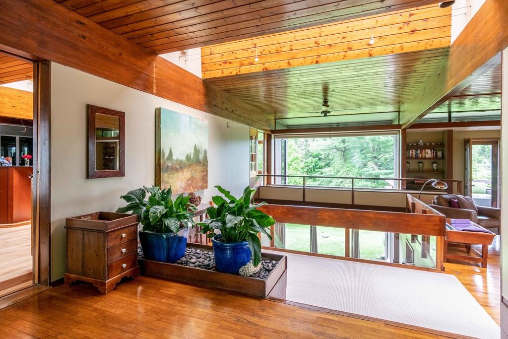 67 Conant Road Lincoln, MA 01773 - Photo 7 of 38 a living room filled with furniture window and a potted plant