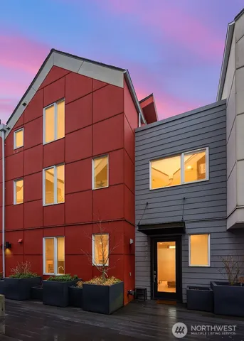 a view of a brick building with many windows