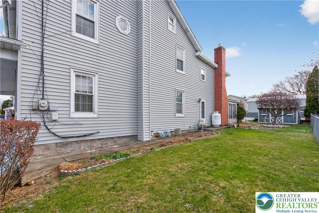 108 West 2nd Street Alburtis, PA 18011 - Photo 20 of 24 a backyard of a house with table and chairs