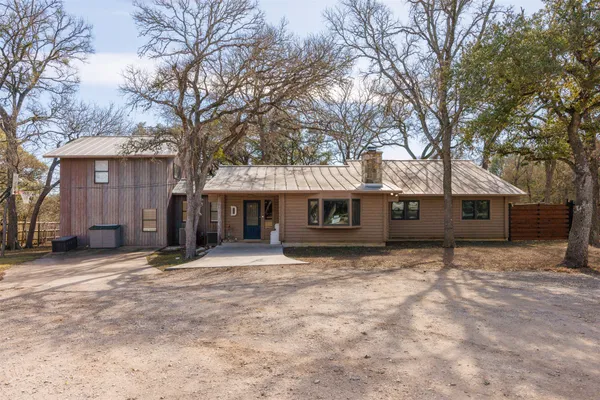 a house with trees in front of it