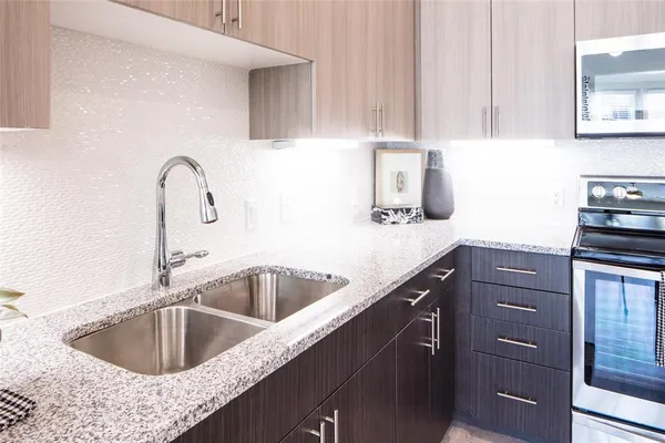 a kitchen with a sink and cabinets