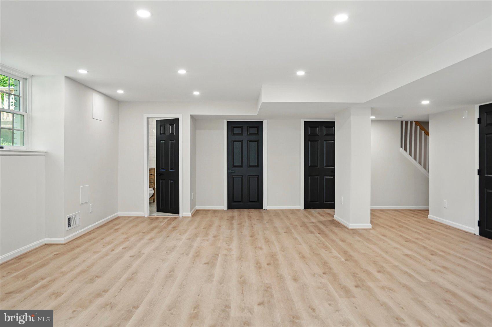1504 Ameshire Road Lutherville-Timonium, MD 21093 - Photo 53 of 54 a view of an empty room with wooden floor and a window