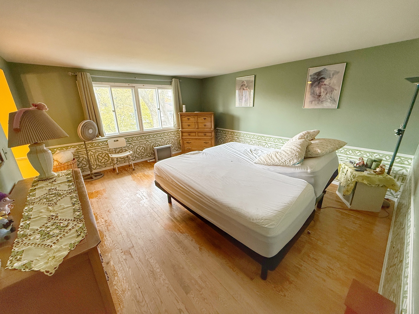 526 Springinsguth Road Schaumburg, IL 60193 - Photo 12 of 24 a bedroom with a bed and wooden floor