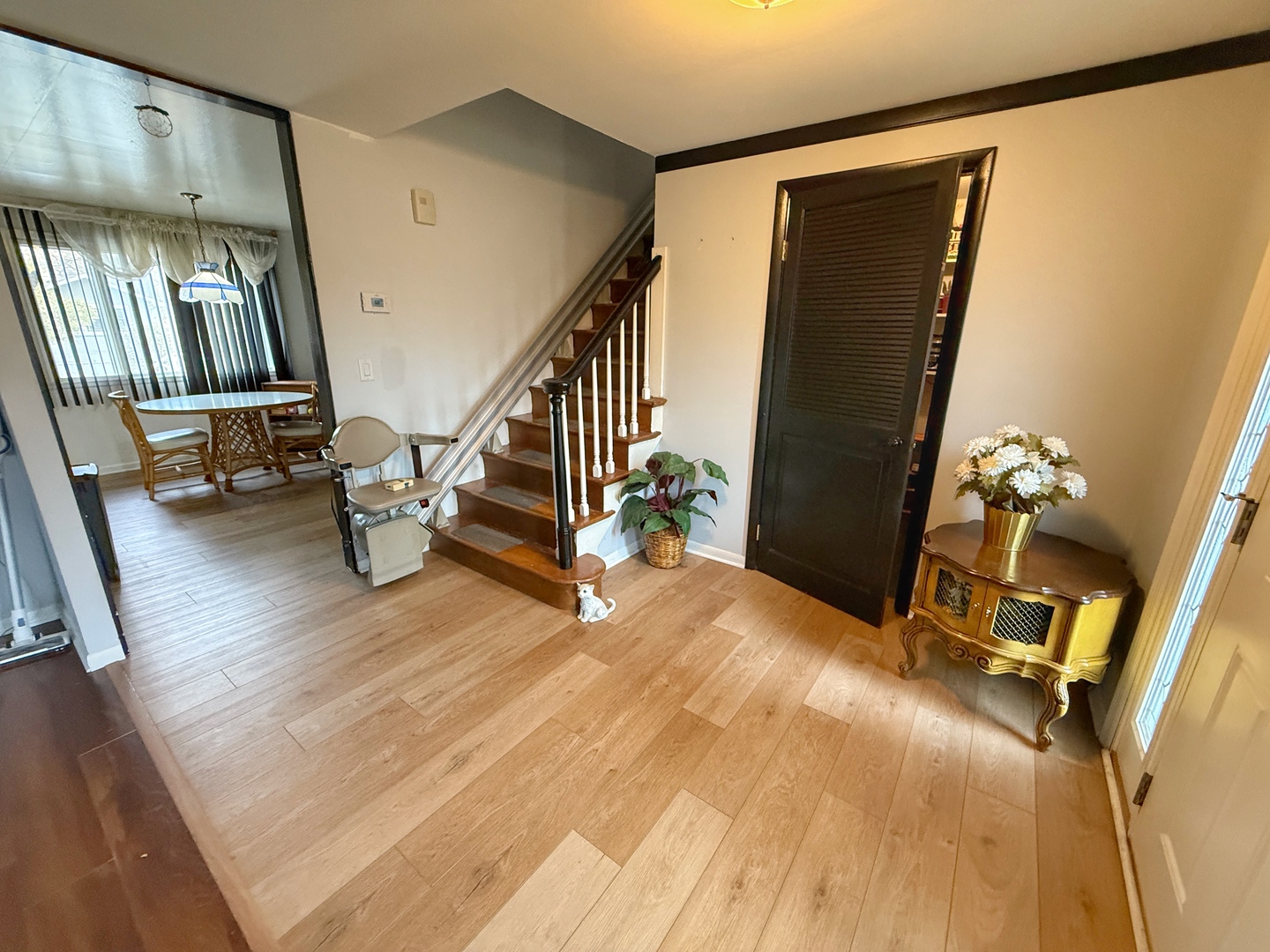 526 Springinsguth Road Schaumburg, IL 60193 - Photo 2 of 24 a view of an empty room with wooden floor and stairs