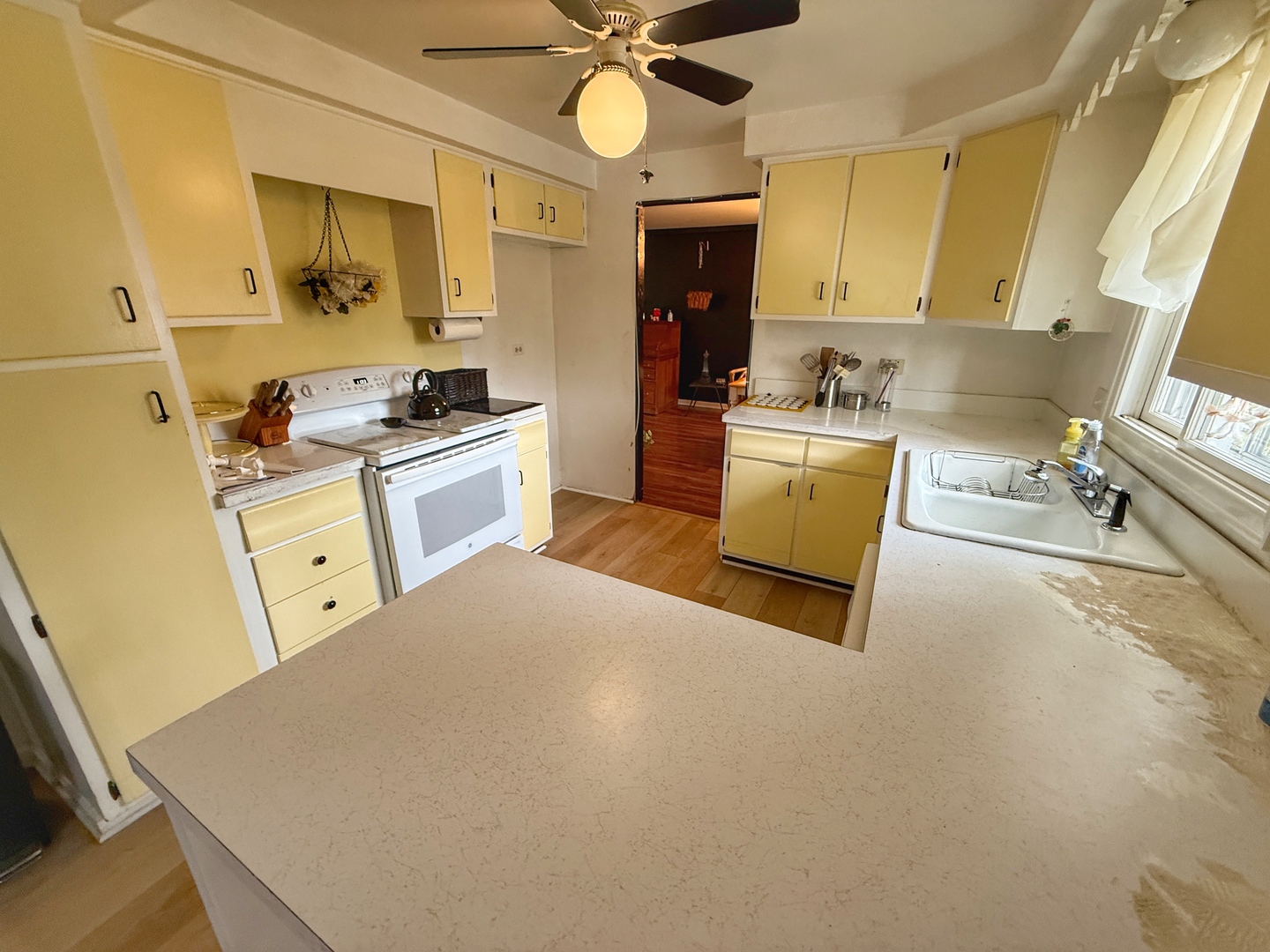 526 Springinsguth Road Schaumburg, IL 60193 - Photo 7 of 24 a kitchen with a stove a sink and a refrigerator