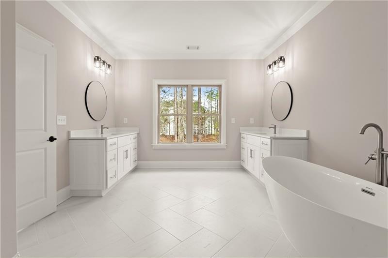 222 Trecastle Square, Unit 21 Canton, GA 30114 - Photo 24 of 45 a bathroom with a sink a mirror and a window