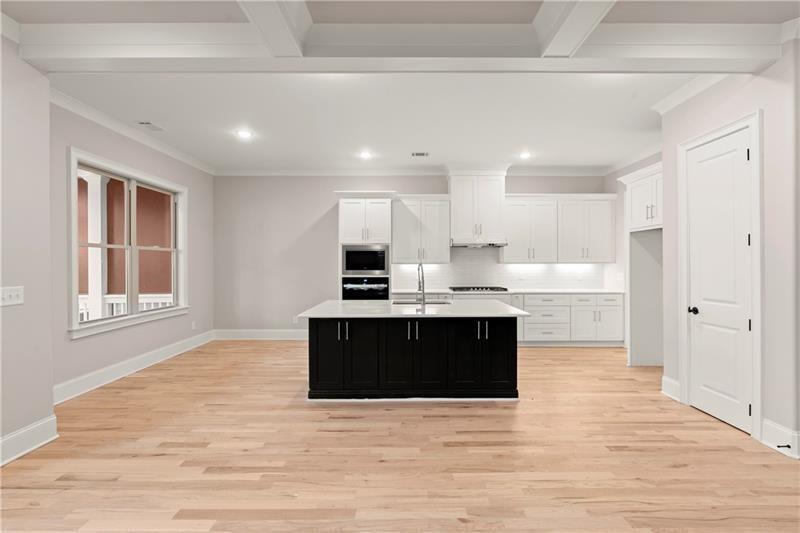 222 Trecastle Square, Unit 21 Canton, GA 30114 - Photo 6 of 45 a view of kitchen with kitchen island stainless steel appliances wooden floor and window