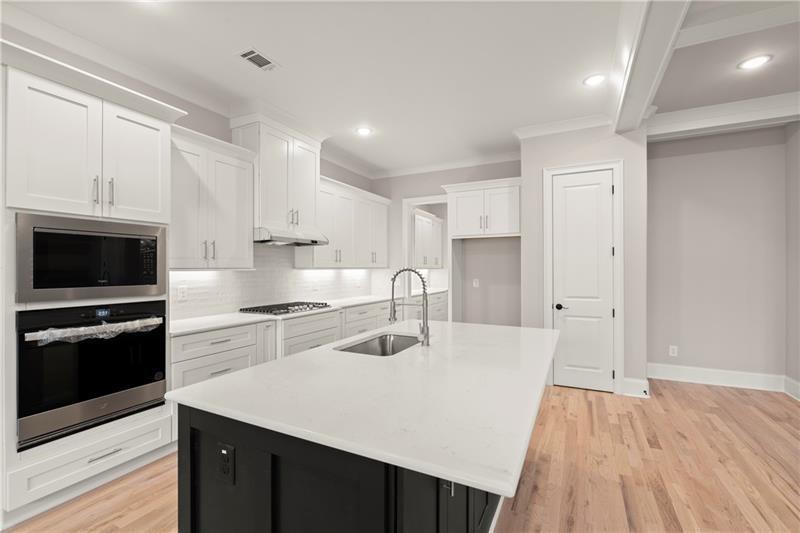 222 Trecastle Square, Unit 21 Canton, GA 30114 - Photo 7 of 45 a kitchen with a sink a stove and refrigerator