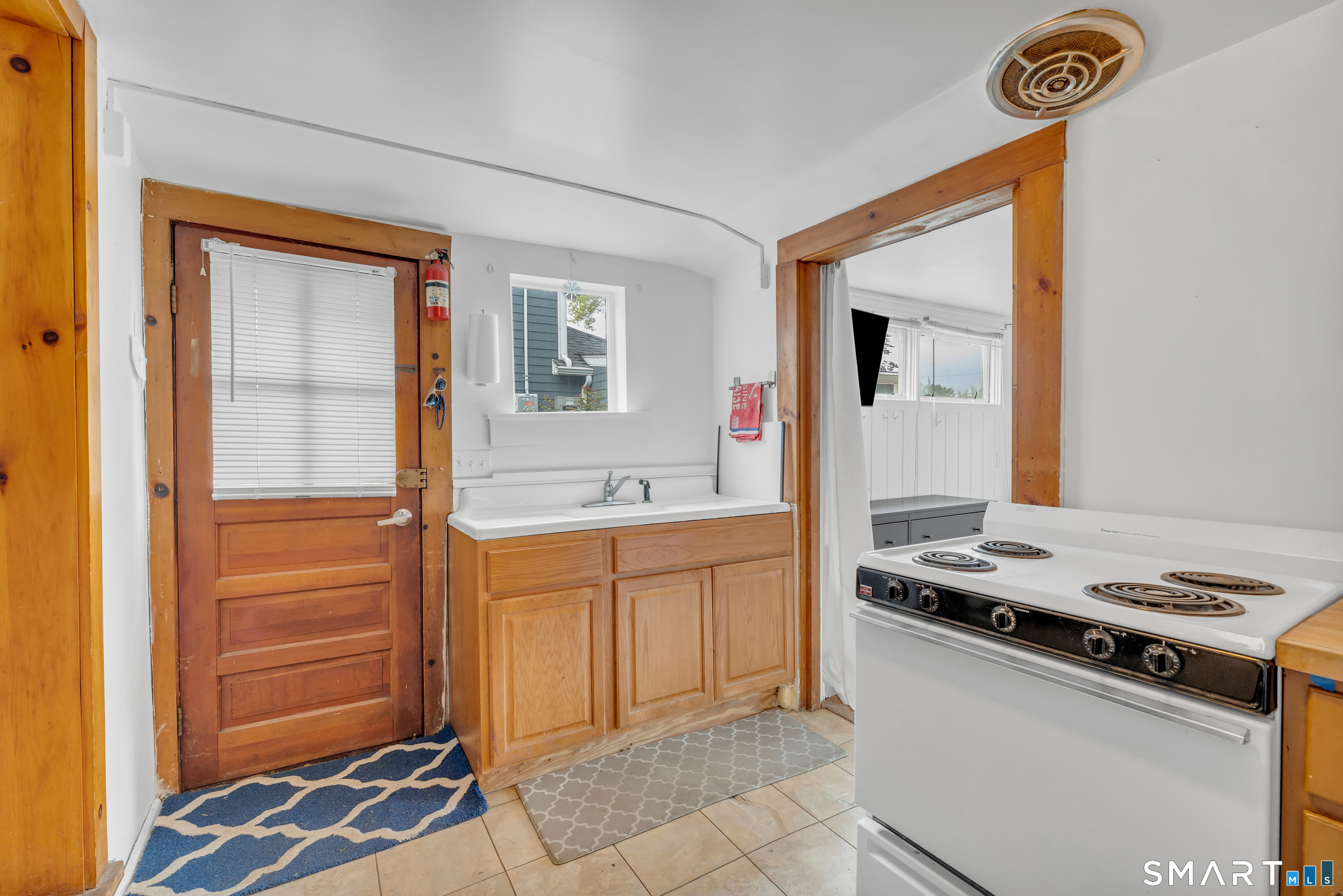 67 Blakeman Road Madison, CT 06443 - Photo 17 of 23 Tile floor in the cozy kitchen too.