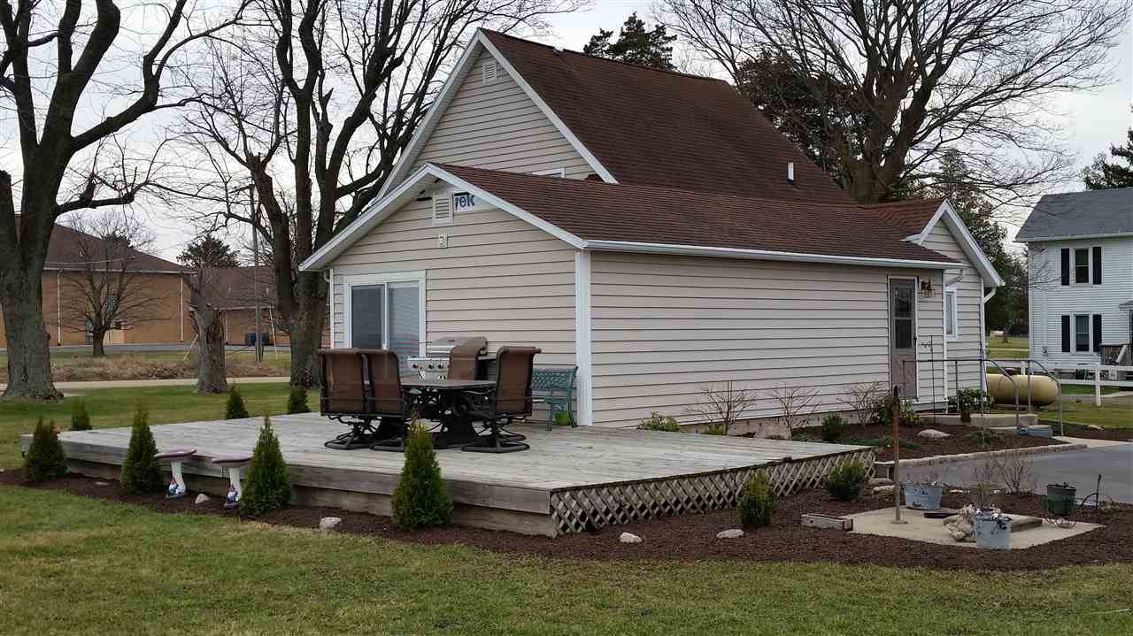 3112 East Holcomb Road Oregon, IL 61061 - Photo 2 of 25 a view of a house with backyard and sitting area