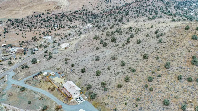 a view of a yard with a mountain