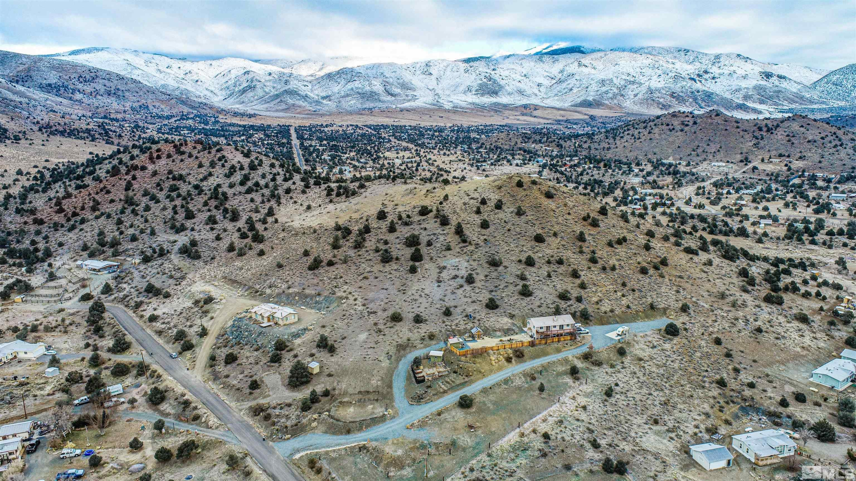 1471 Breccia Road Wellington, NV 89444 - Photo 14 of 15 a view of a dry field with mountains in the background
