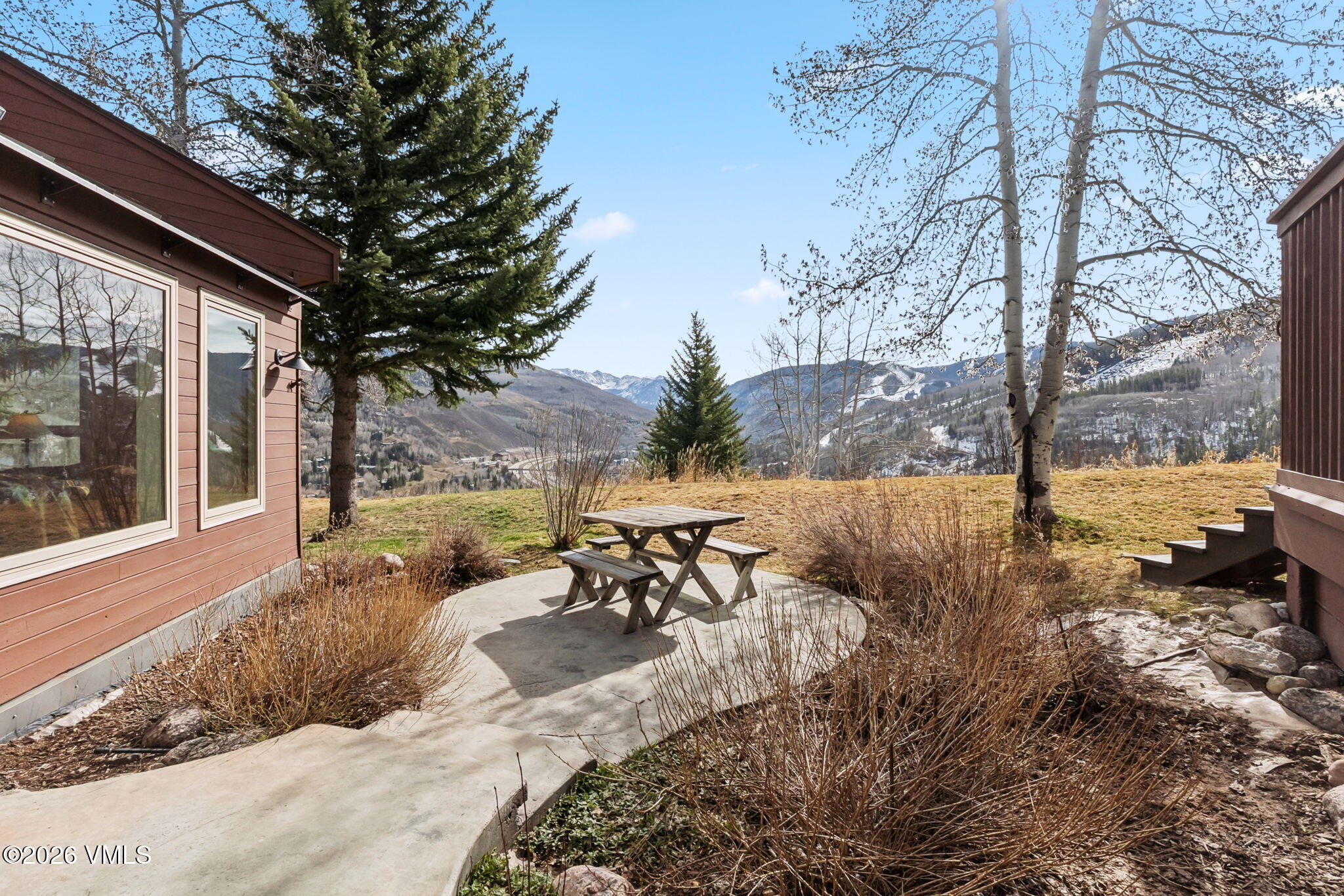 1460 Ridge Lane, Unit D Vail, CO 81657 - Photo 17 of 18 a view of a backyard with sitting area
