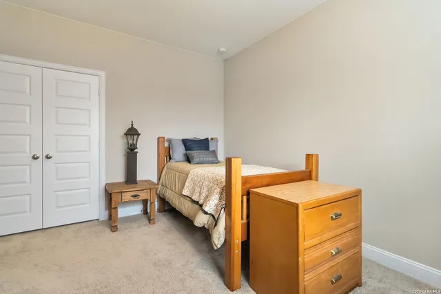 a bedroom with a bed and a closet