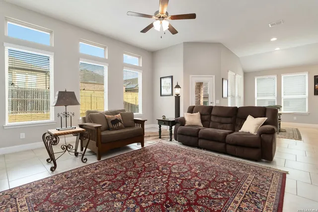a living room with furniture and a large window