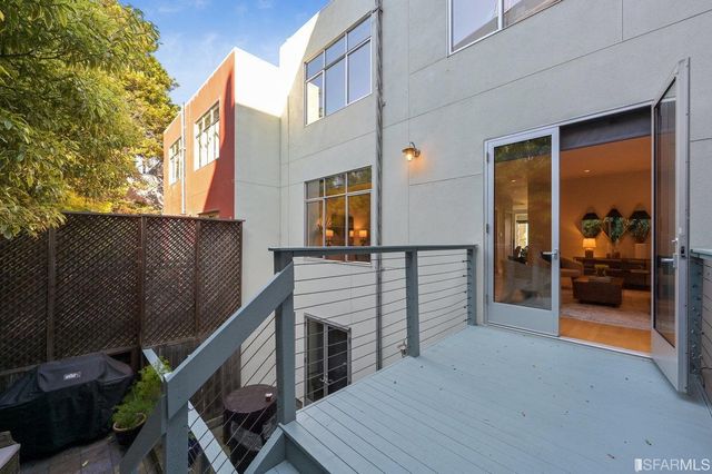 a workspace with furniture and a potted plant
