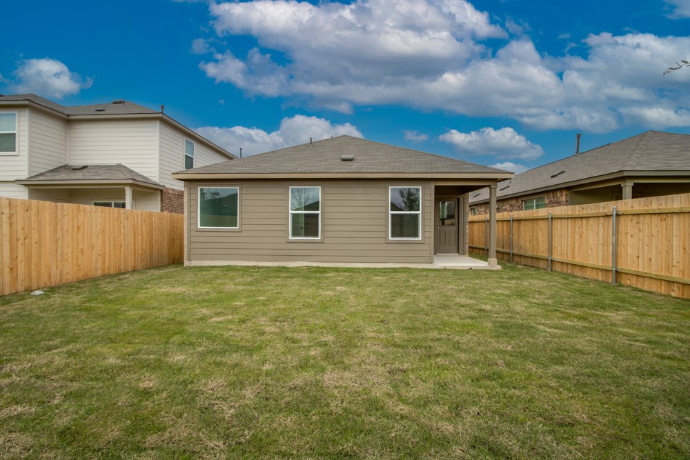 309 Canley Loop Hutto, TX 78634 - Photo 24 of 27 a backyard of a house