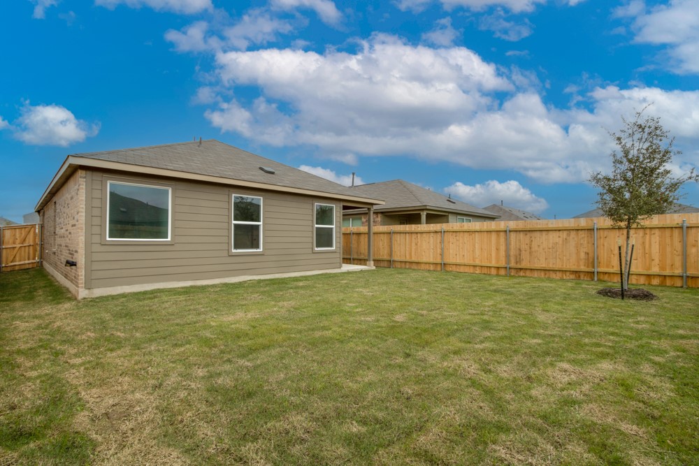 309 Canley Loop Hutto, TX 78634 - Photo 25 of 27 a view of a backyard
