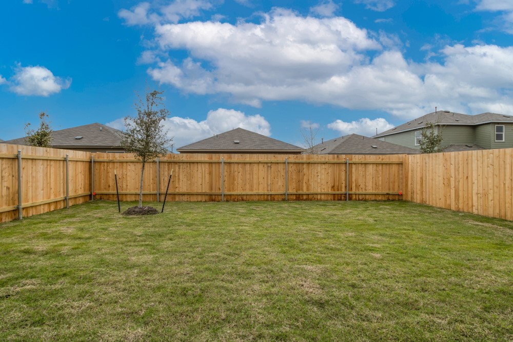 309 Canley Loop Hutto, TX 78634 - Photo 27 of 27 a view of a backyard