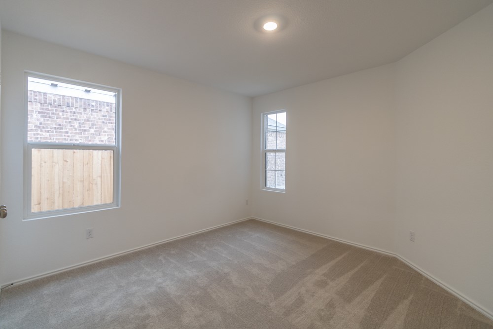 309 Canley Loop Hutto, TX 78634 - Photo 10 of 27 an empty room with a window