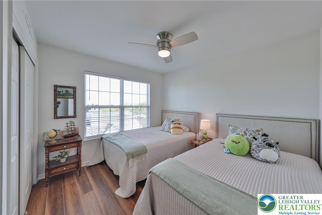 163 Muirfield Way Easton, PA 18042 - Photo 26 of 48 a bedroom with two beds and wooden floor