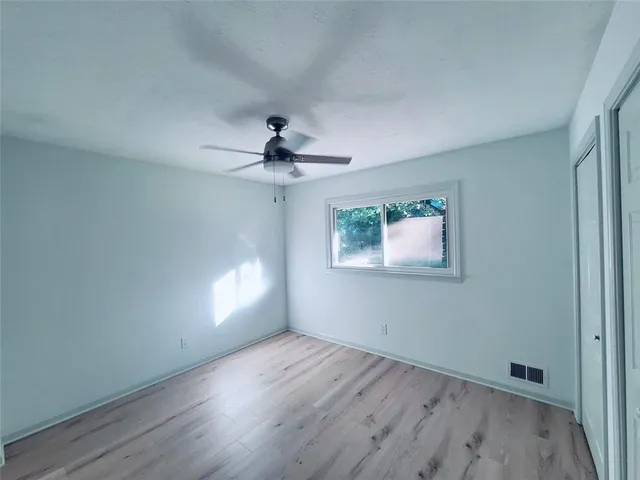 a bathroom with a double vanity sink toilet and a mirror