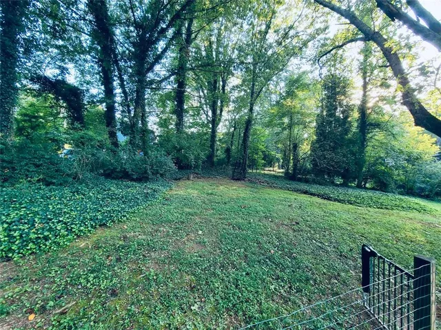a view of a house with a back yard