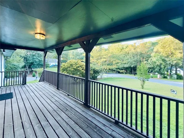 a view of balcony with wooden floor